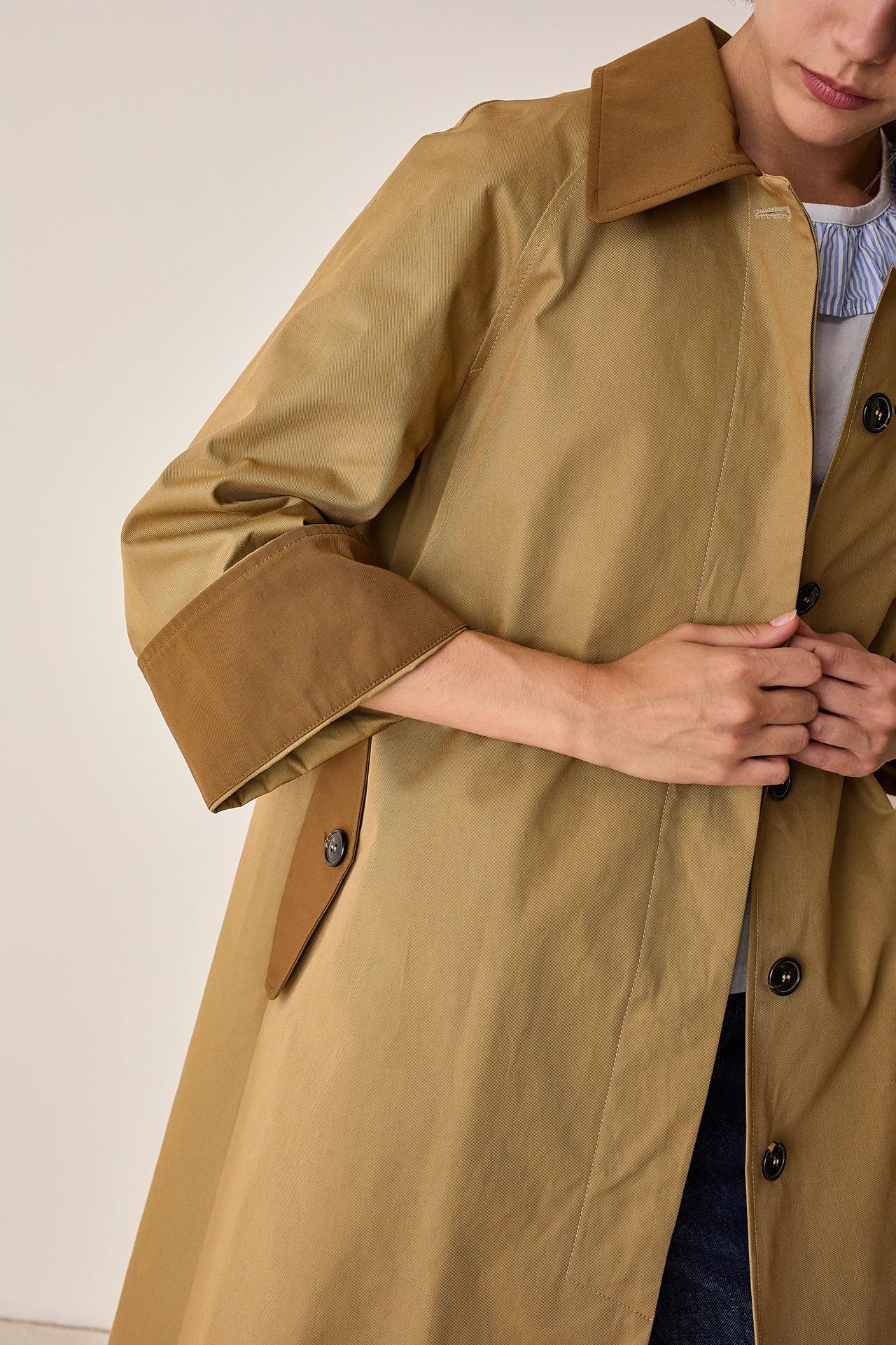 Trench coat with contrasting details