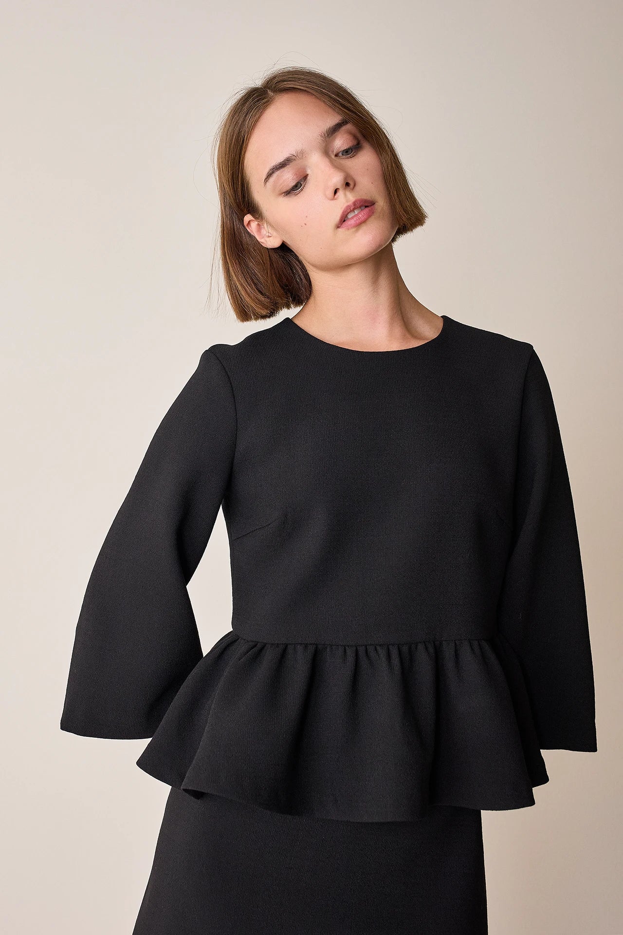 Top con balza in lana stretch