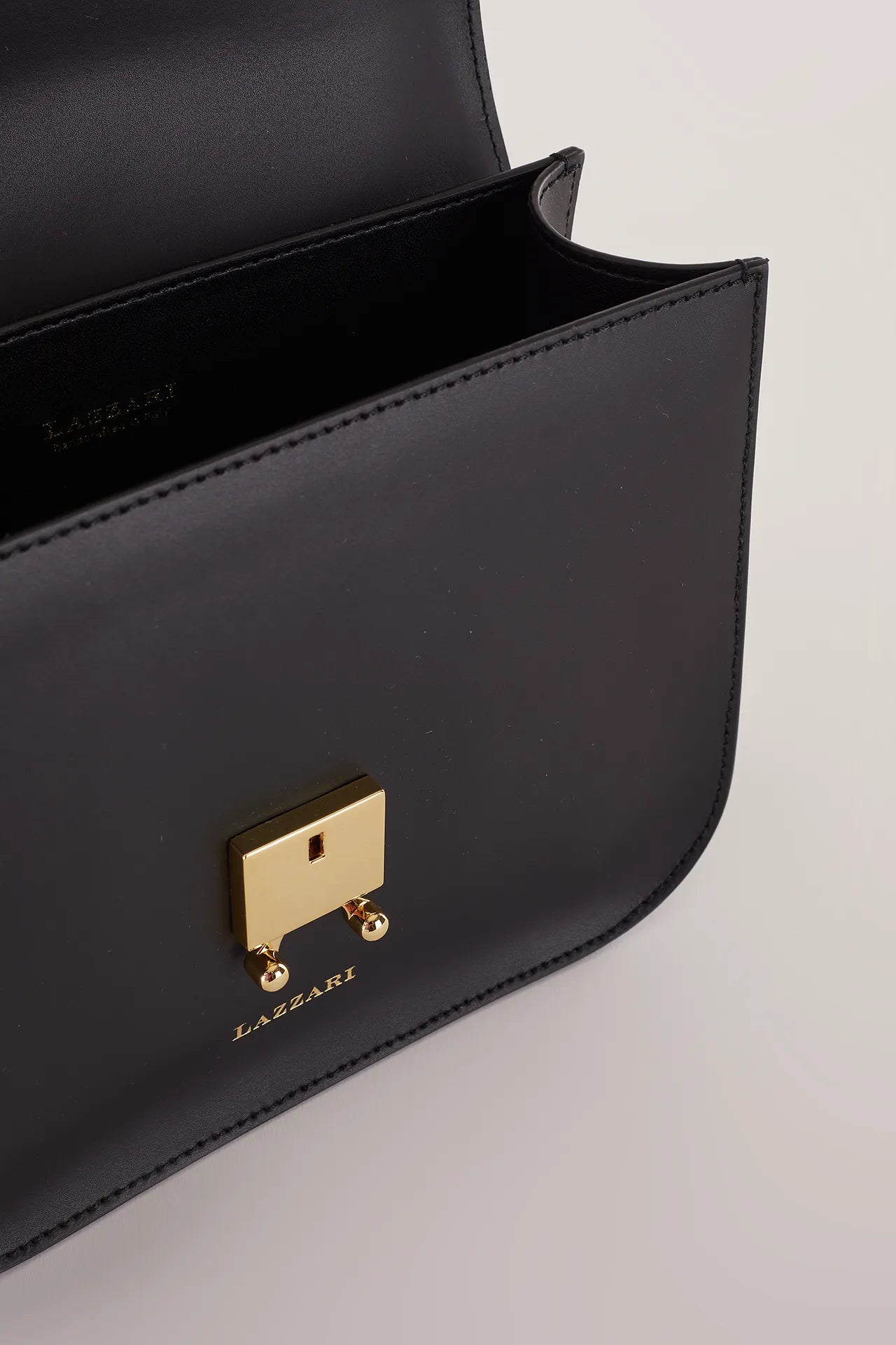 Rectangular shoulder bag with push-lock fastening
