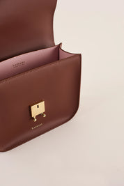 Rectangular shoulder bag with push-lock fastening