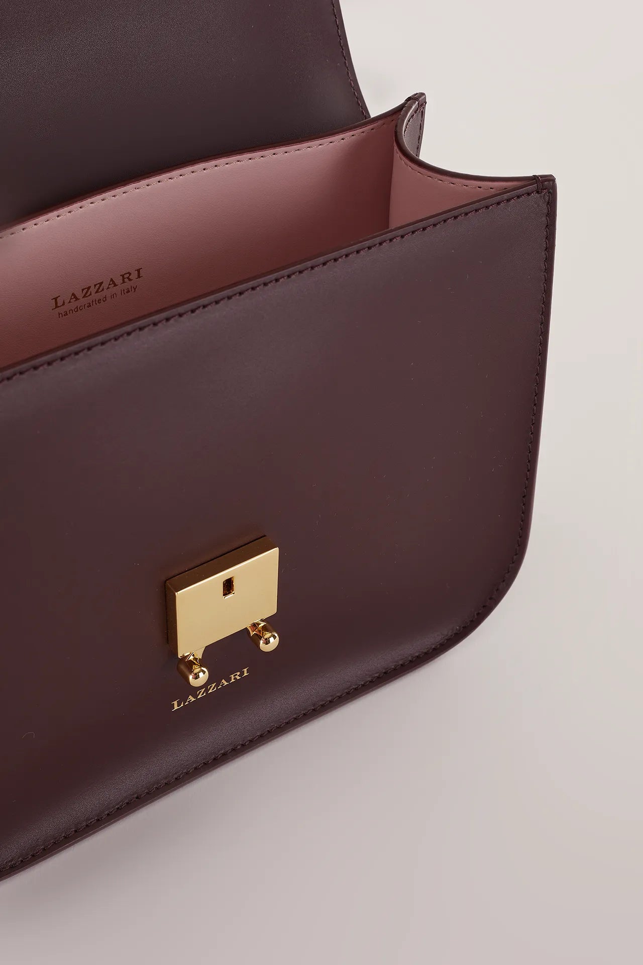 Rectangular shoulder bag with push-lock fastening