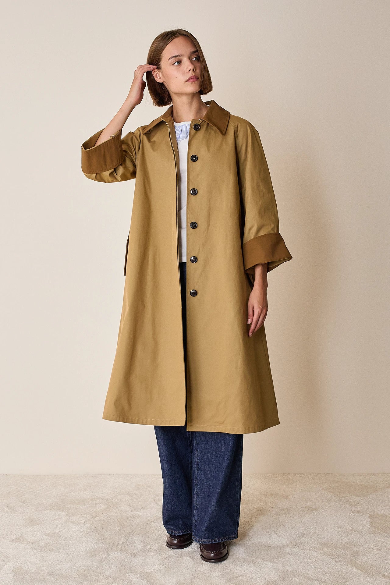 Trench coat with contrasting details