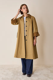 Trench coat with contrasting details