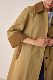 Trench coat with contrasting details