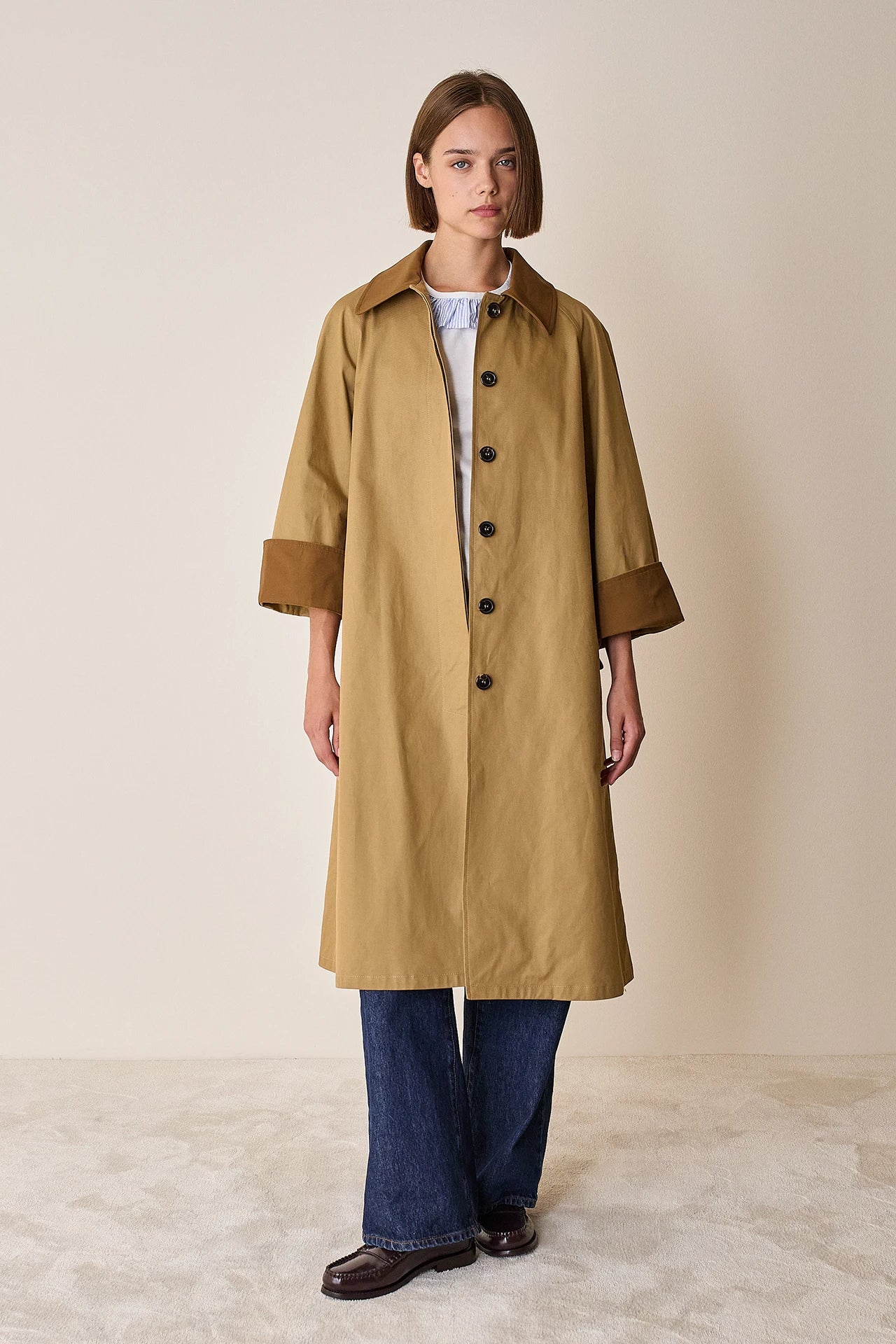 Trench coat with contrasting details