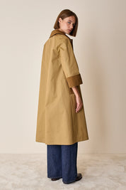 Trench coat with contrasting details