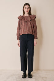 Top a quadretti con maxi volant