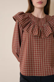 Top a quadretti con maxi volant