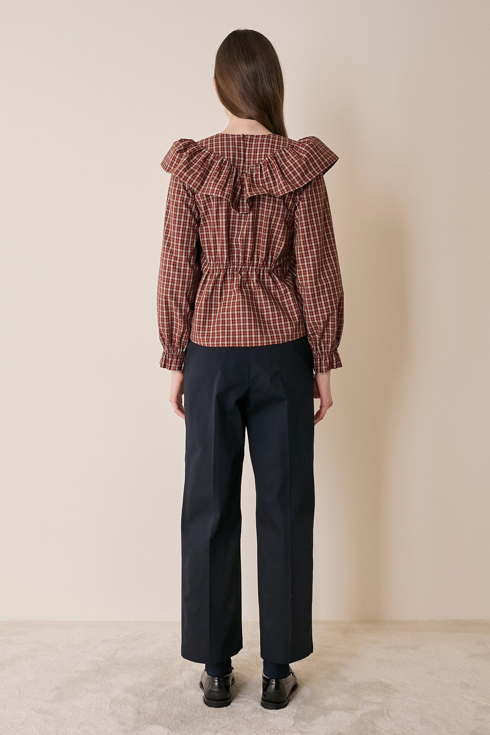 Top a quadretti con maxi volant