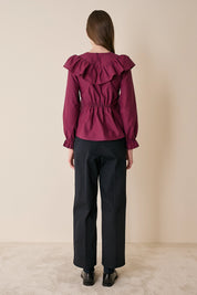 Top a quadretti con maxi volant