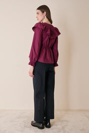 Top a quadretti con maxi volant