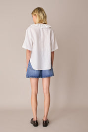 Linen polo top with ruffles