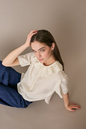 Polo in lino con volant