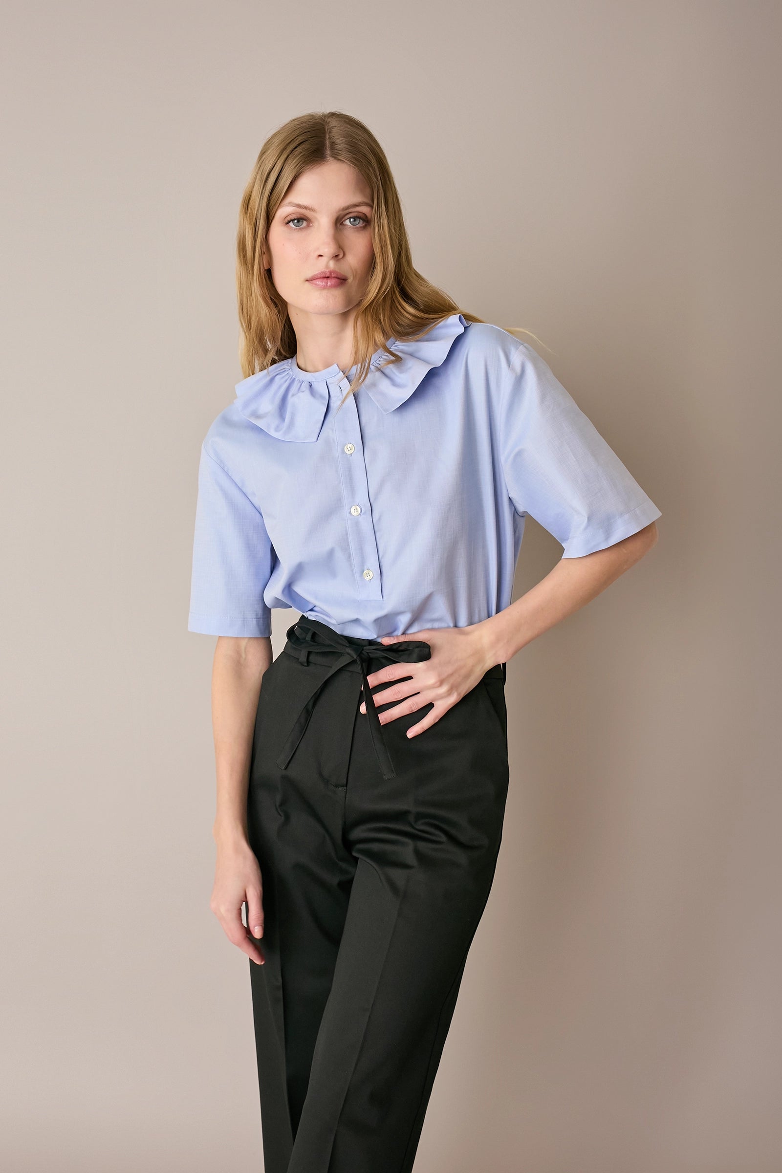 Polo in cotone con volant