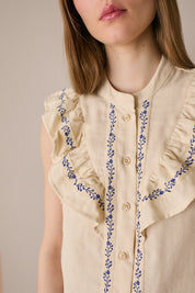 Camicetta con volant e passamaneria a fiori