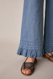 Pantaloni in lino con volant