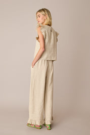Pantaloni in lino con volant