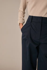 Pantaloni con piega e risvolto