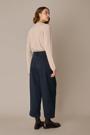 Pantaloni con piega e risvolto