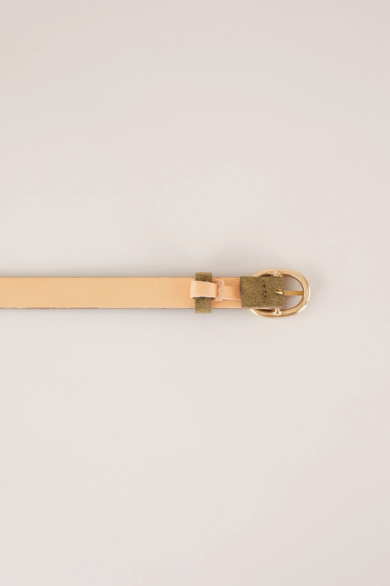 Thin leather belt with gold oval buckle