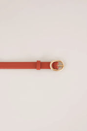 Thin leather belt with gold oval buckle