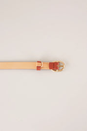 Thin leather belt with gold oval buckle