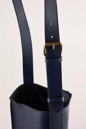 Leather bucket bag with strap