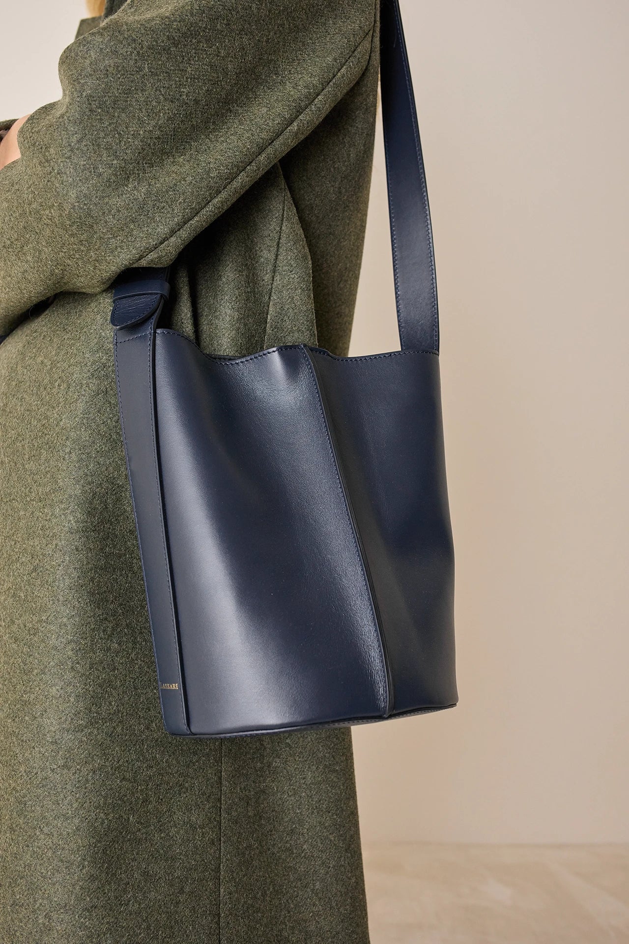 Leather bucket bag with strap