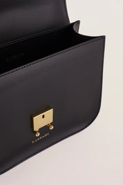 Rectangular shoulder bag with push-lock fastening