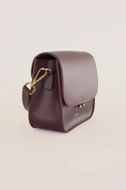 Rectangular shoulder bag with push-lock fastening
