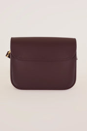 Rectangular shoulder bag with push-lock fastening