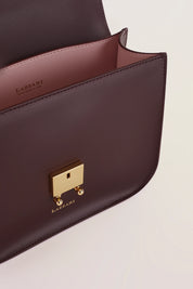 Rectangular shoulder bag with push-lock fastening