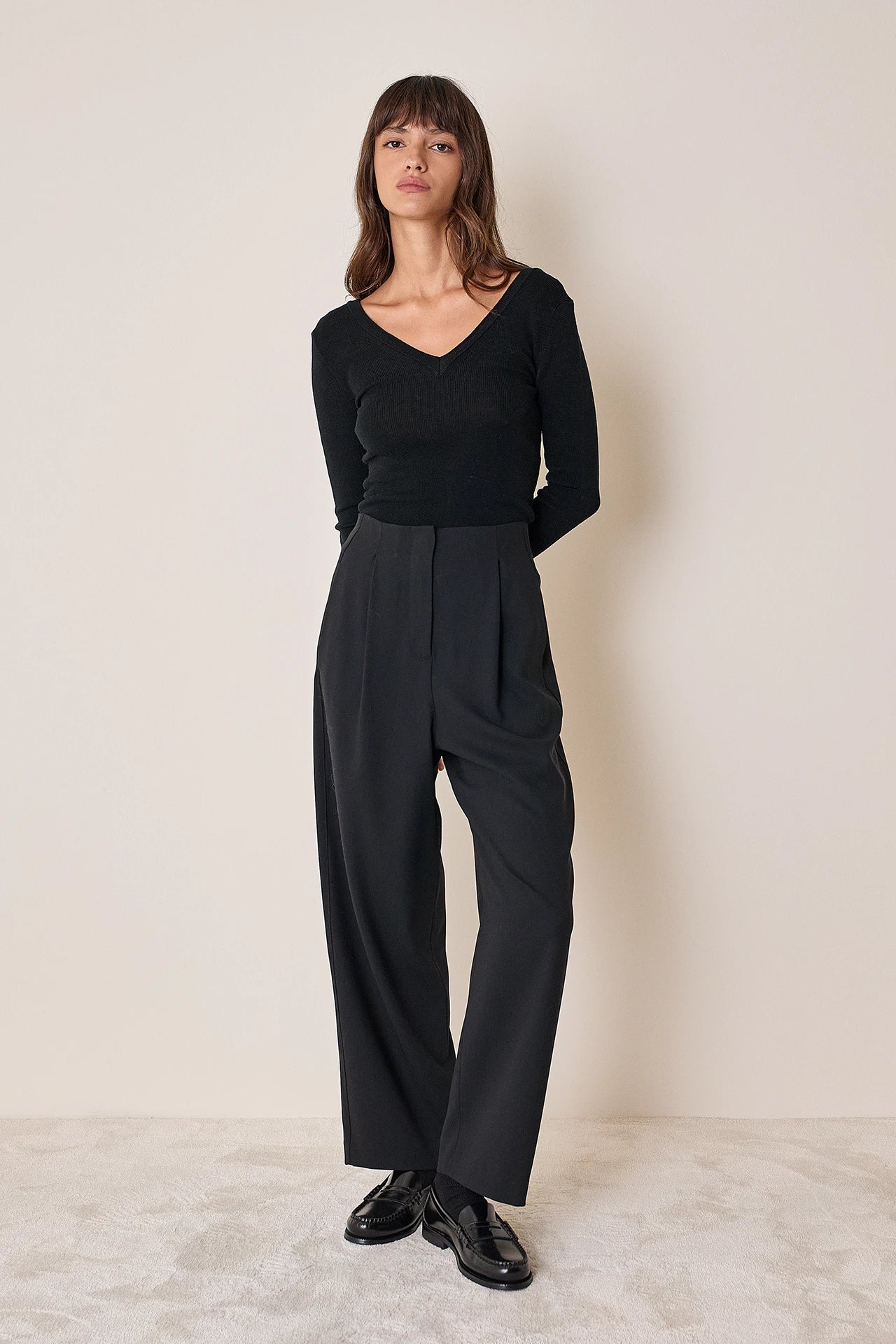 Pullover con scollo a V sulla schiena