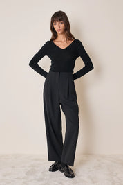 Pullover con scollo a V sulla schiena