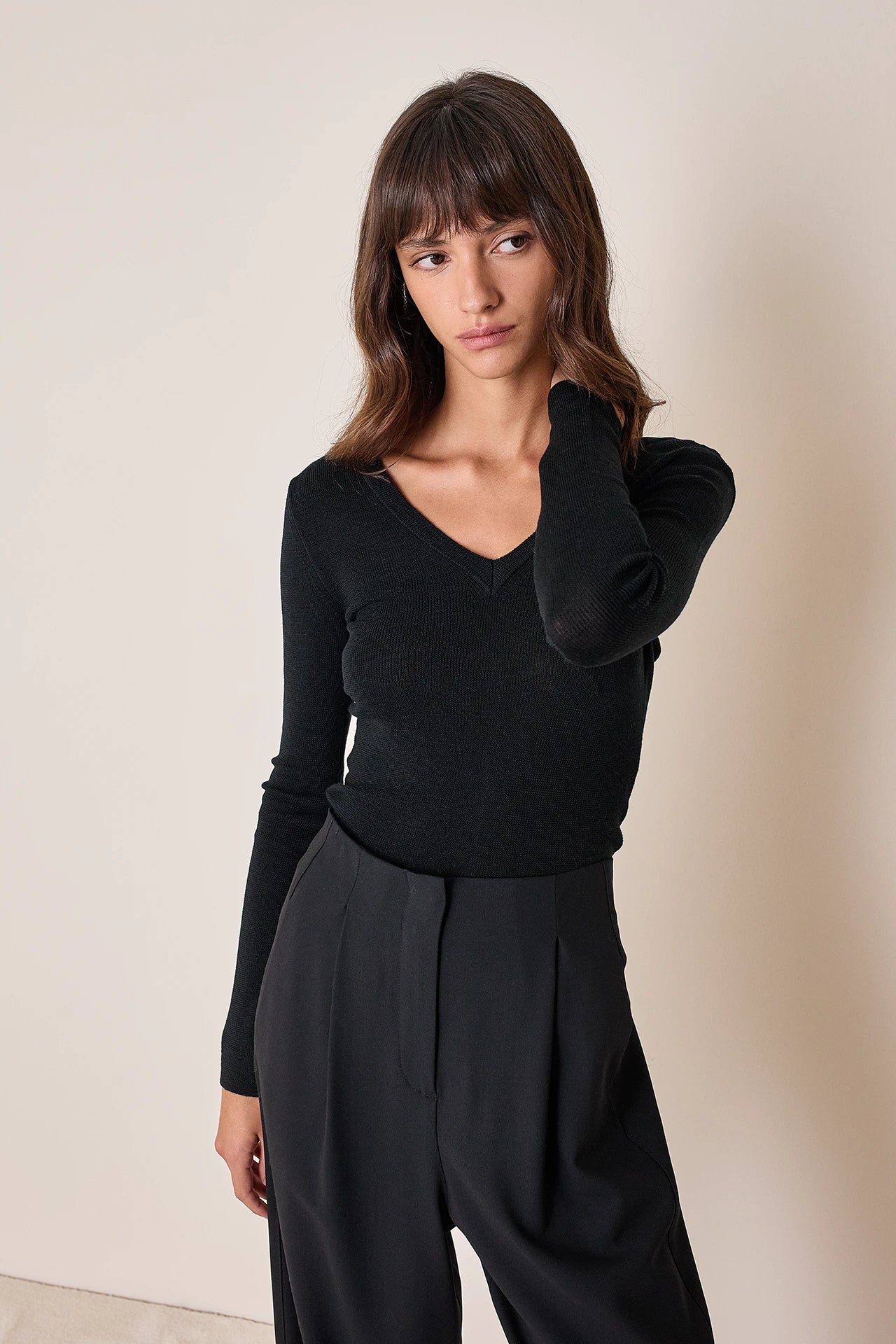 Pullover con scollo a V sulla schiena