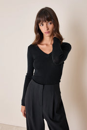 Pullover con scollo a V sulla schiena