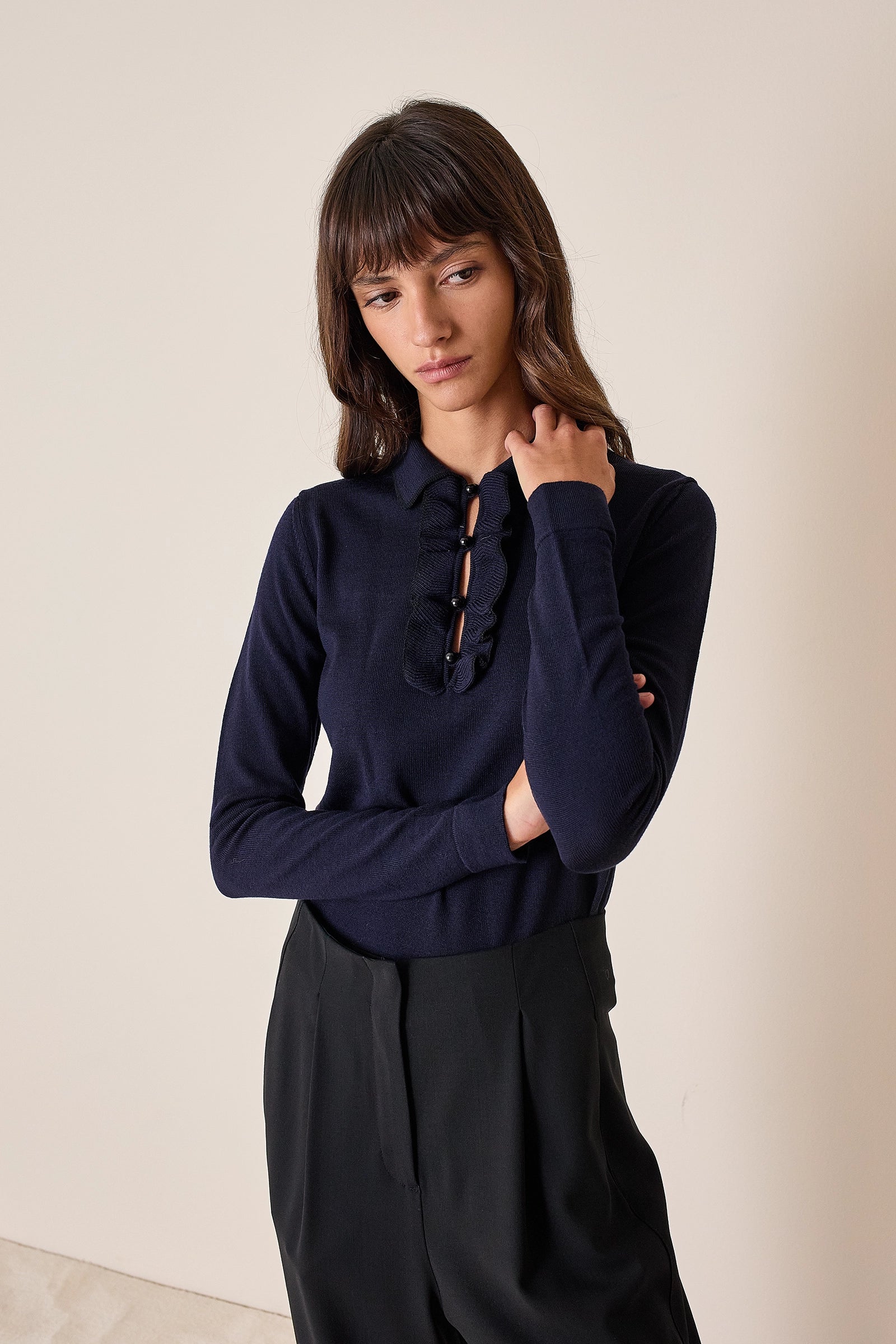 Polo shirt with ruffles and ball buttons