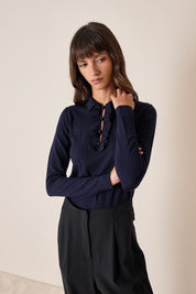 Polo shirt with ruffles and ball buttons