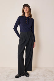 Polo shirt with ruffles and ball buttons