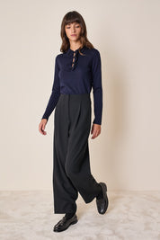 Polo shirt with ruffles and ball buttons