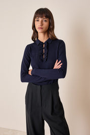 Polo shirt with ruffles and ball buttons