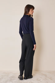 Polo shirt with ruffles and ball buttons