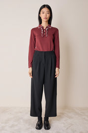 Polo shirt with ruffles and ball buttons