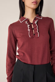 Polo shirt with ruffles and ball buttons
