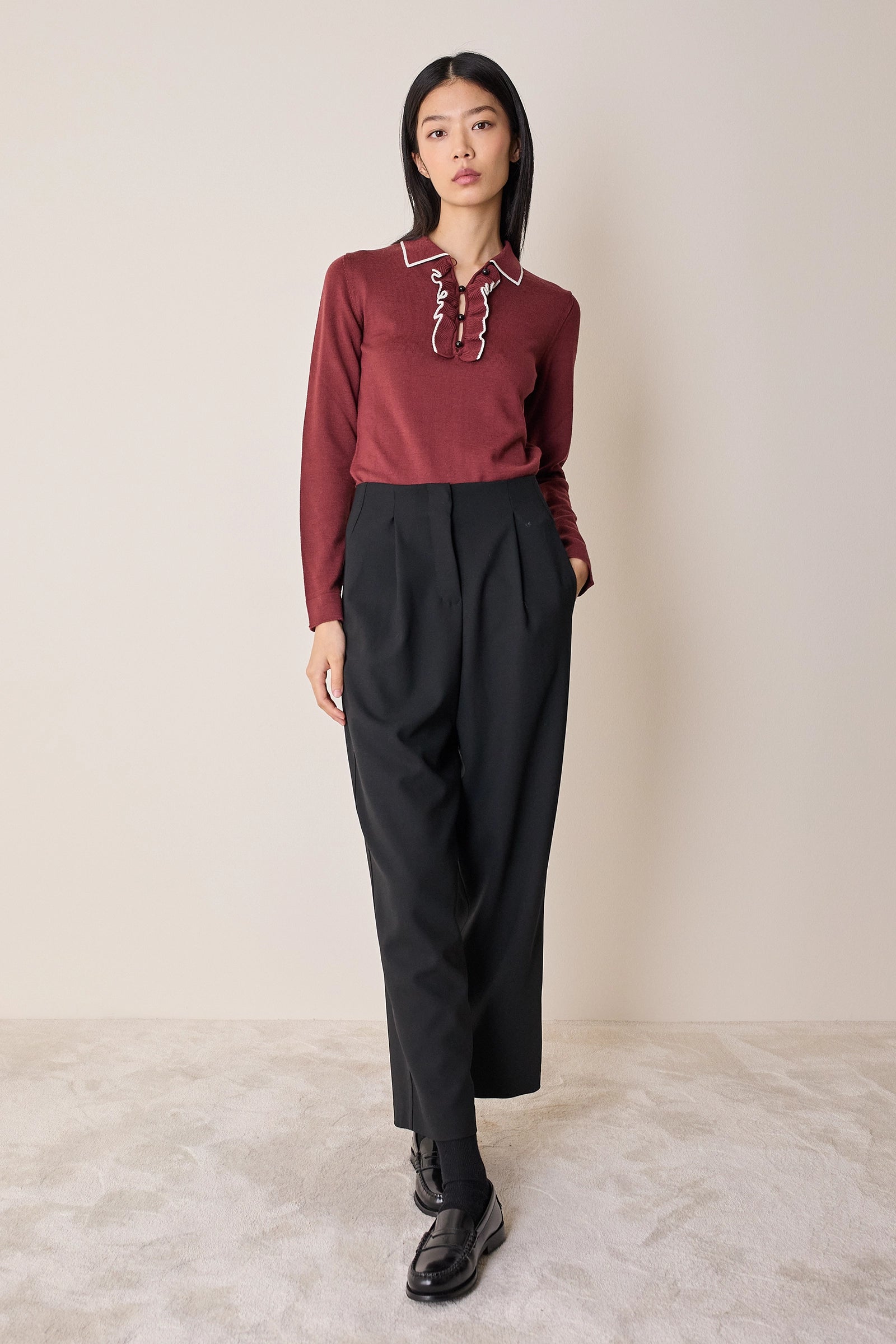 Polo shirt with ruffles and ball buttons