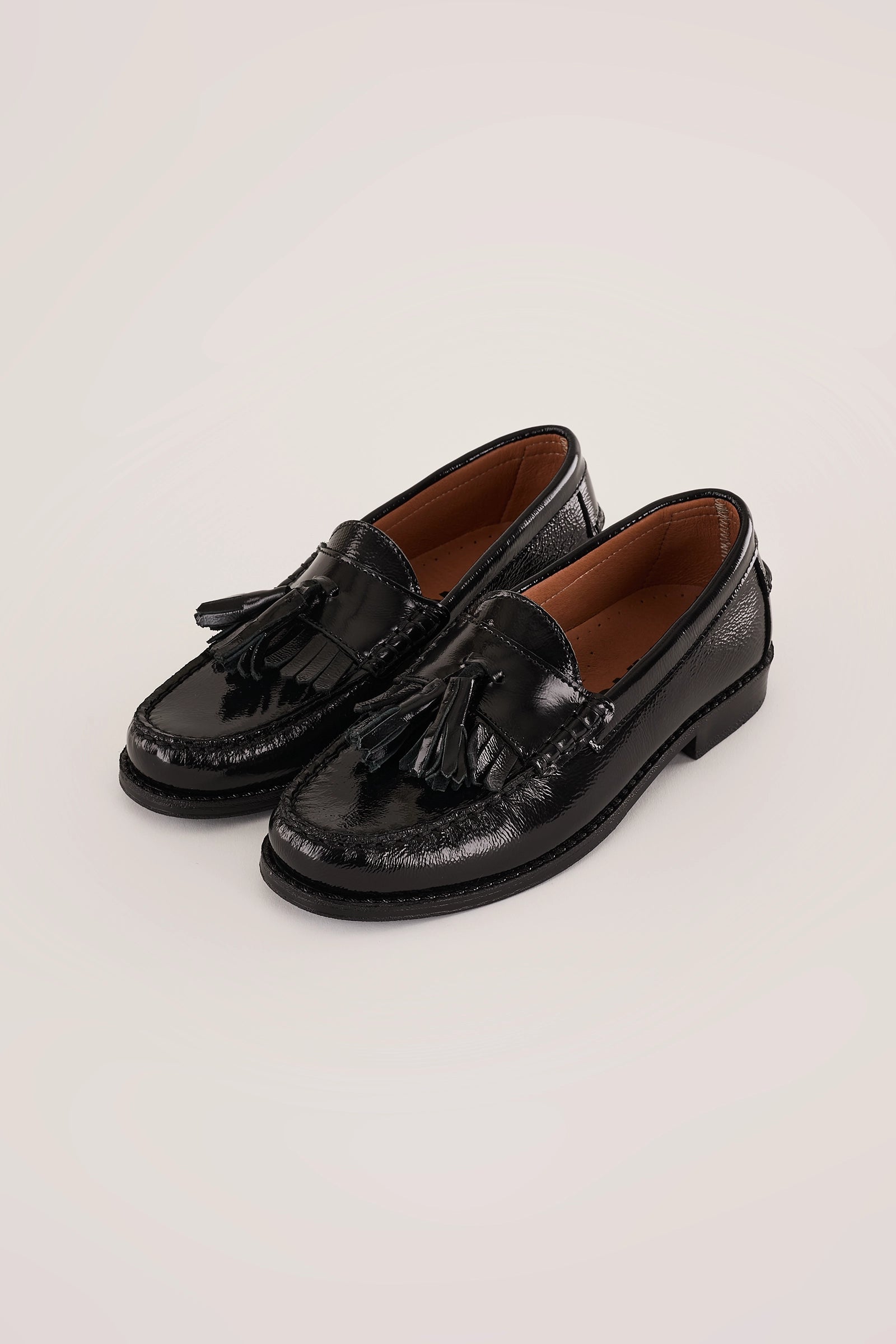 Mocassini in vernice morbida con nappine – Bianco